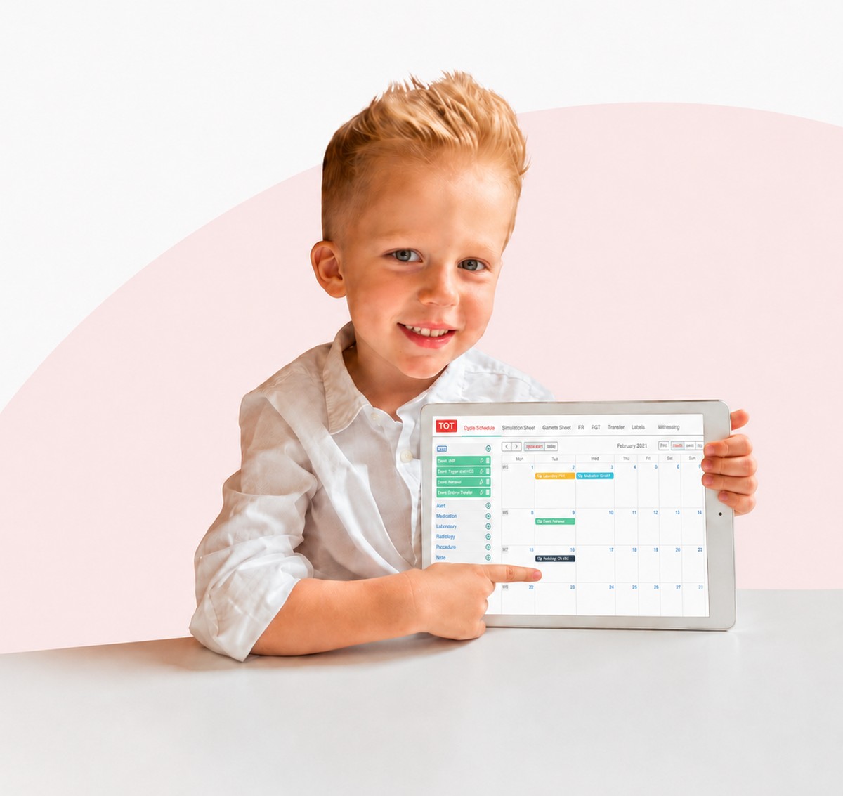 A young boy holding a tablet that shows the TOT cycle schedule.